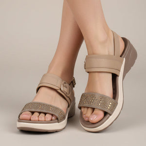 Beige sandals with a strap on a white background